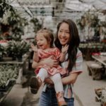 Mom holding happy toddler